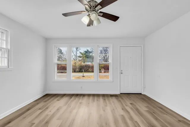 a view of an empty room with a window