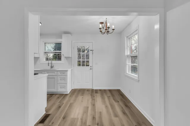 a kitchen with a stove cabinets and a refrigerator
