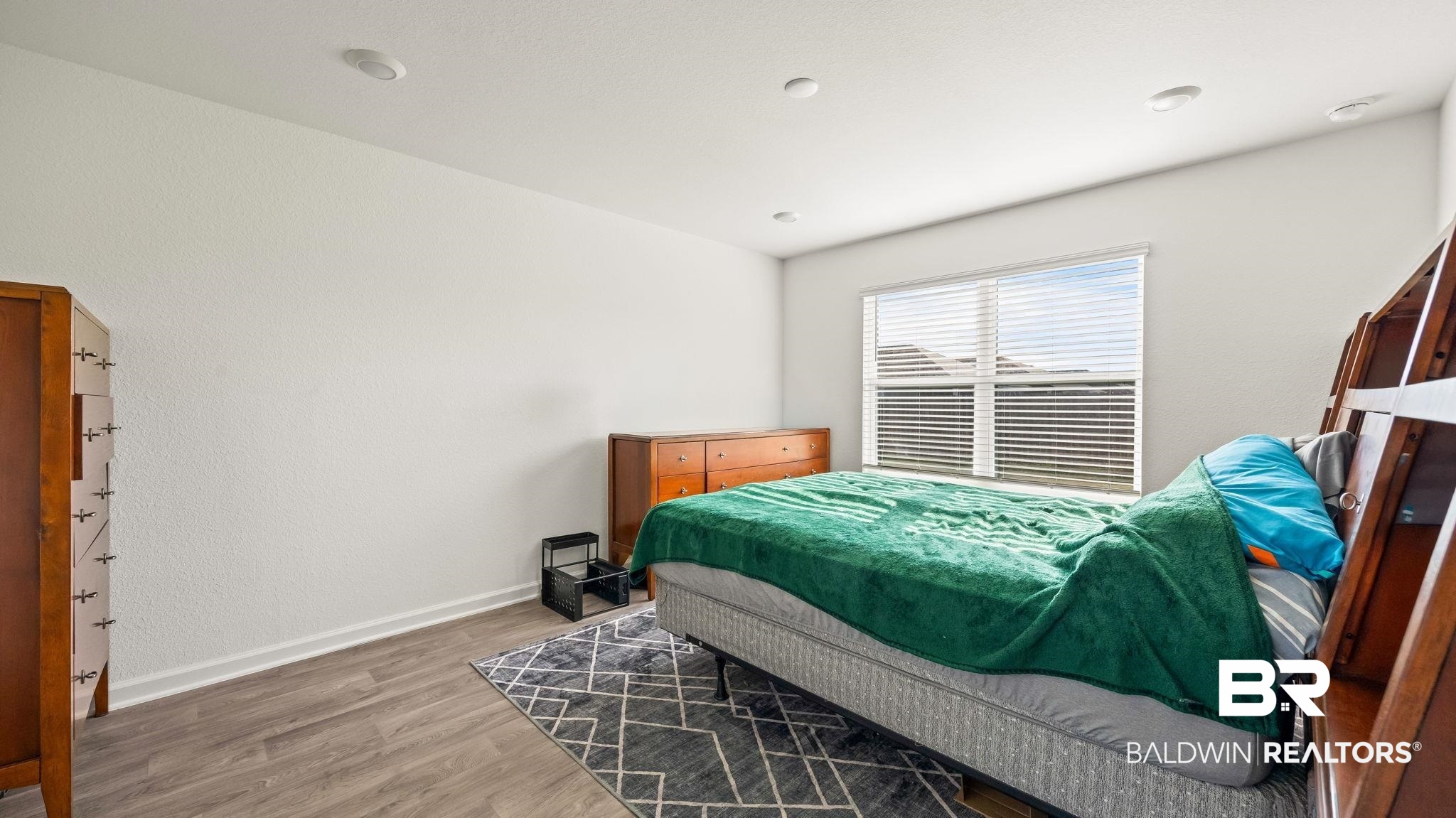 24264 Veranda Circle Elberta, AL 36530 - Photo 26 of 41 Bedroom featuring wood finished floors and baseboards