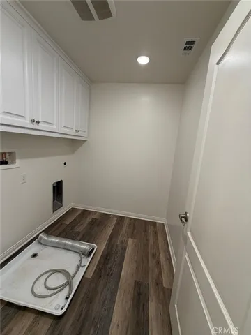a spacious bathroom with a tub sink and mirror