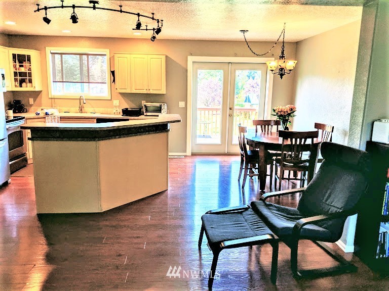 9024 176th Avenue Southwest Rochester, WA 98579 - Photo 4 of 25 a view of a dining room with furniture and window