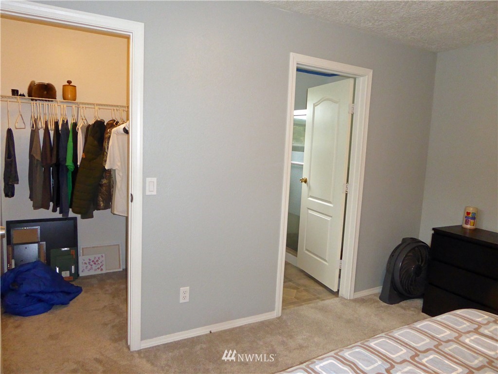 9024 176th Avenue Southwest Rochester, WA 98579 - Photo 8 of 25 a view of a bedroom with a wardrobe space