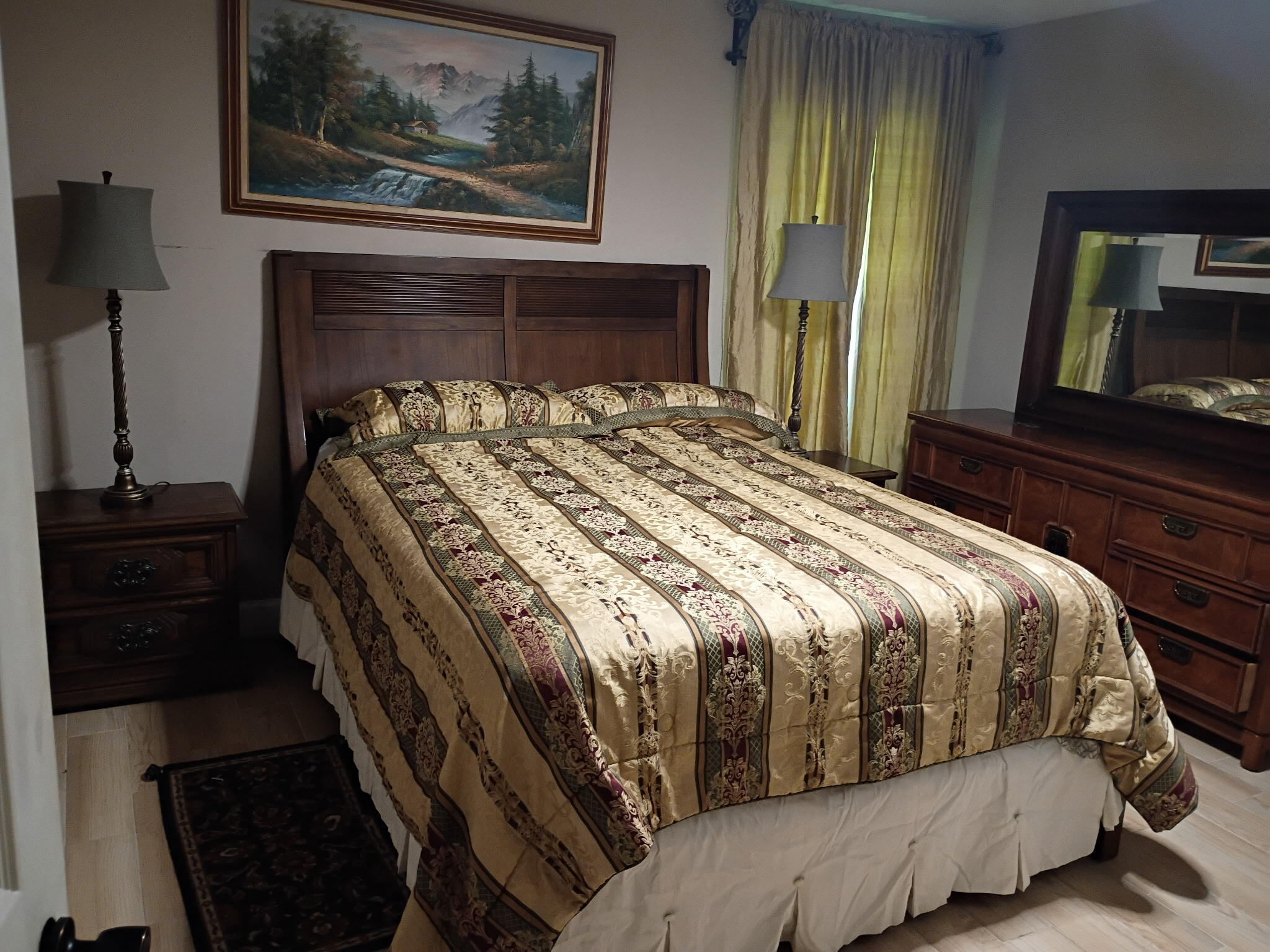 116 Southwest Ridgecrest Drive, Unit A Port St. Lucie, FL 34953 - Photo 1 of 8 a bedroom with a bed and a dresser