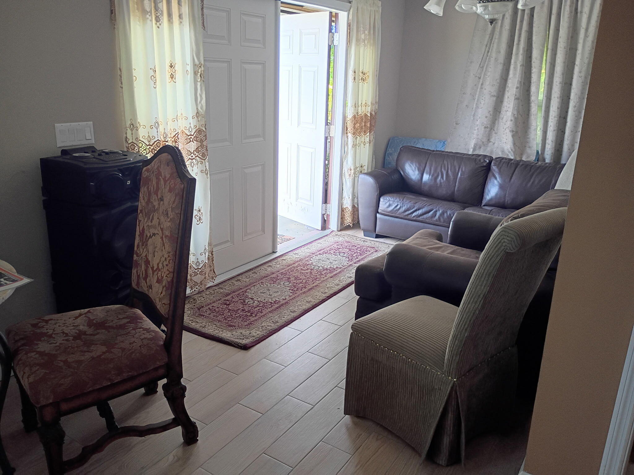 116 Southwest Ridgecrest Drive, Unit A Port St. Lucie, FL 34953 - Photo 6 of 8 a living room with furniture and a window