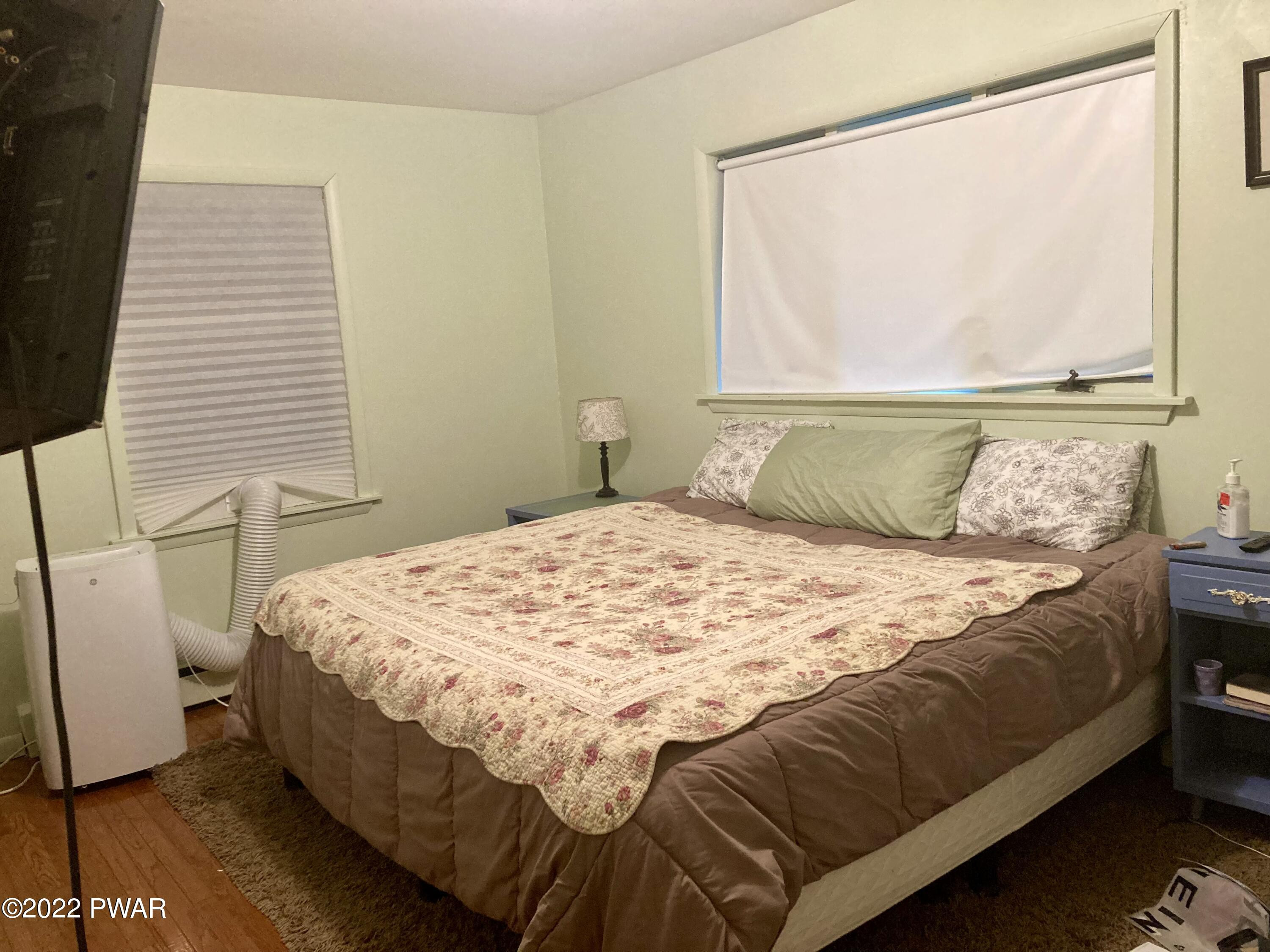 191 Fox Road Dingmans Ferry, PA 18328 - Photo 18 of 27 a bedroom with a bed and a window