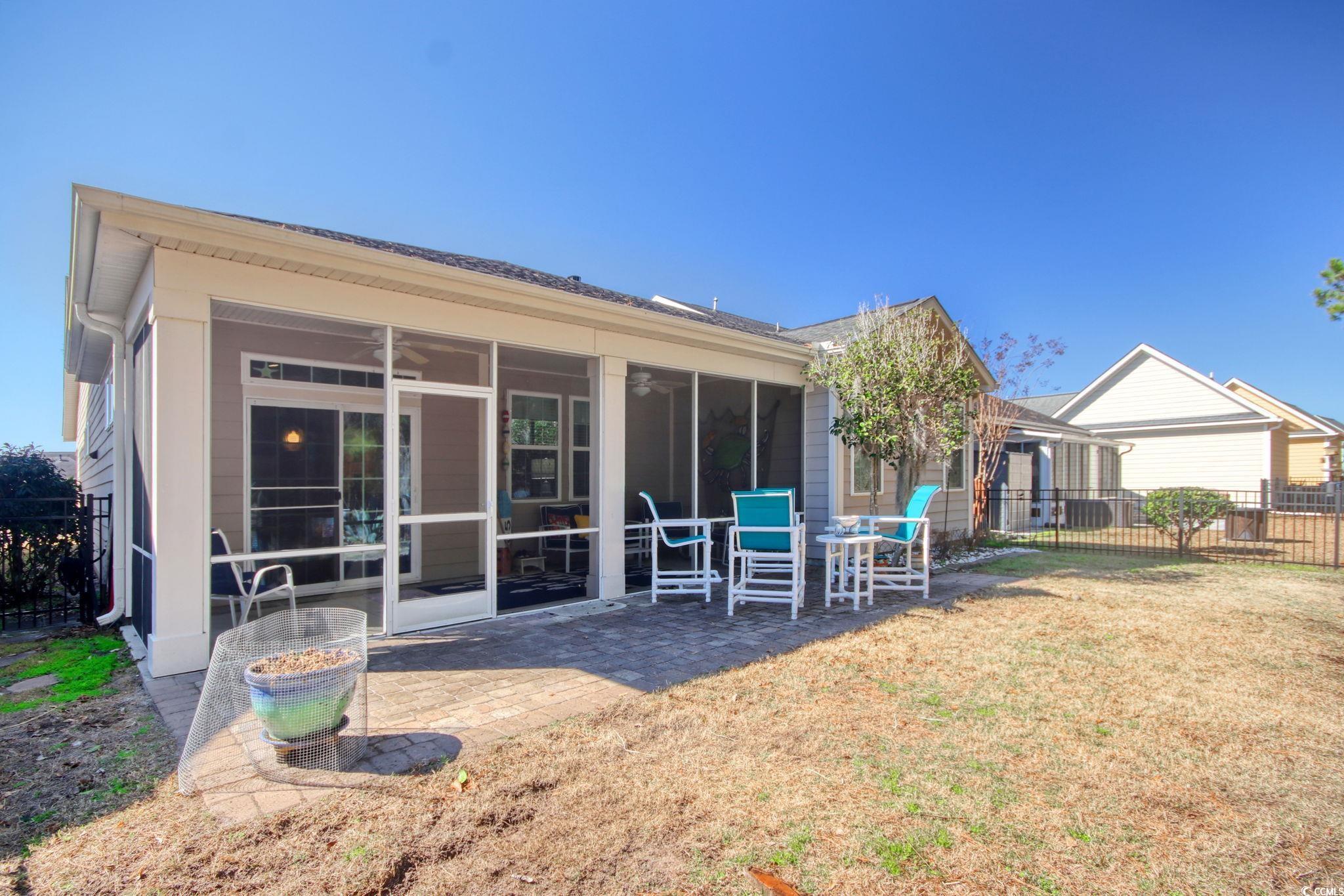 1878 Heritage Loop Myrtle Beach, SC 29577 - Photo 30 of 40 Back of property with a yard, a patio area, fence,