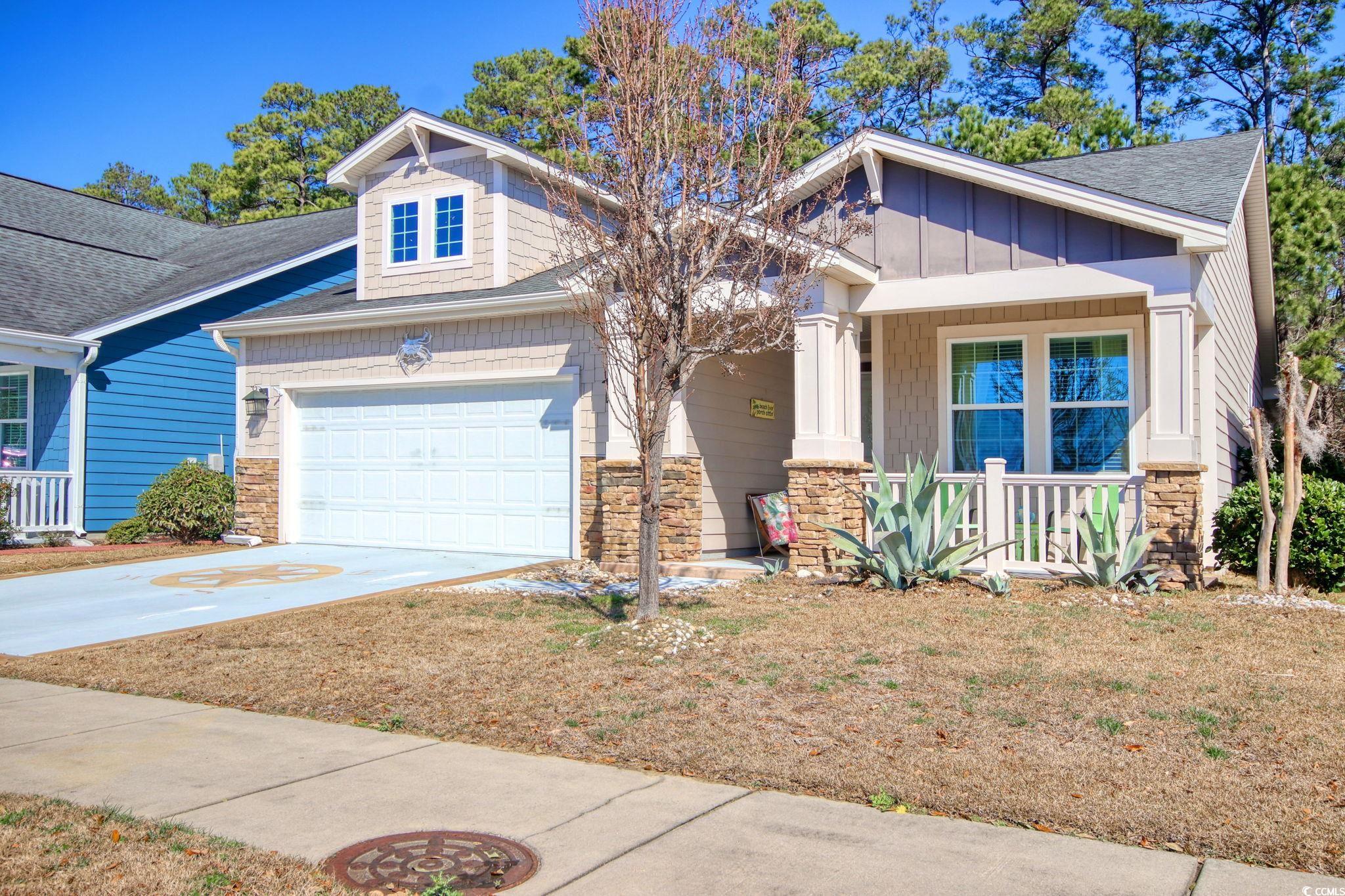 1878 Heritage Loop Myrtle Beach, SC 29577 - Photo 3 of 40 Craftsman-style house with stone siding, a porch,