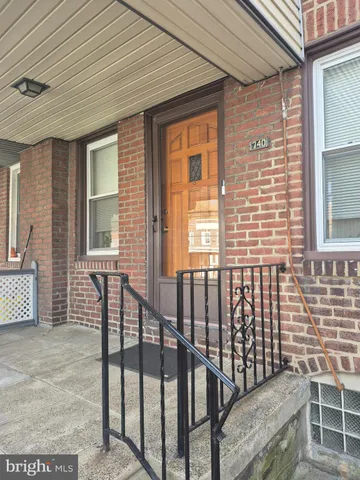 a view of a porch with two chairs