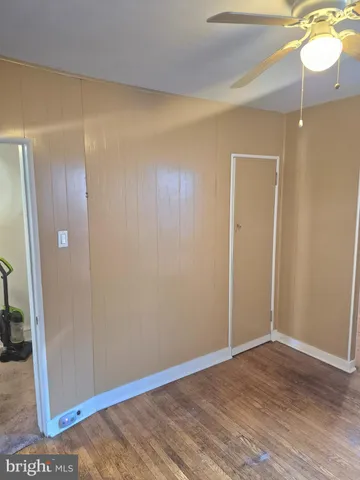 a view of a livingroom with furniture and chandelier fan