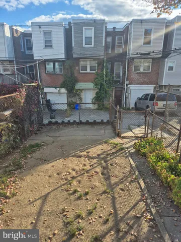 a view of a brick house with many windows