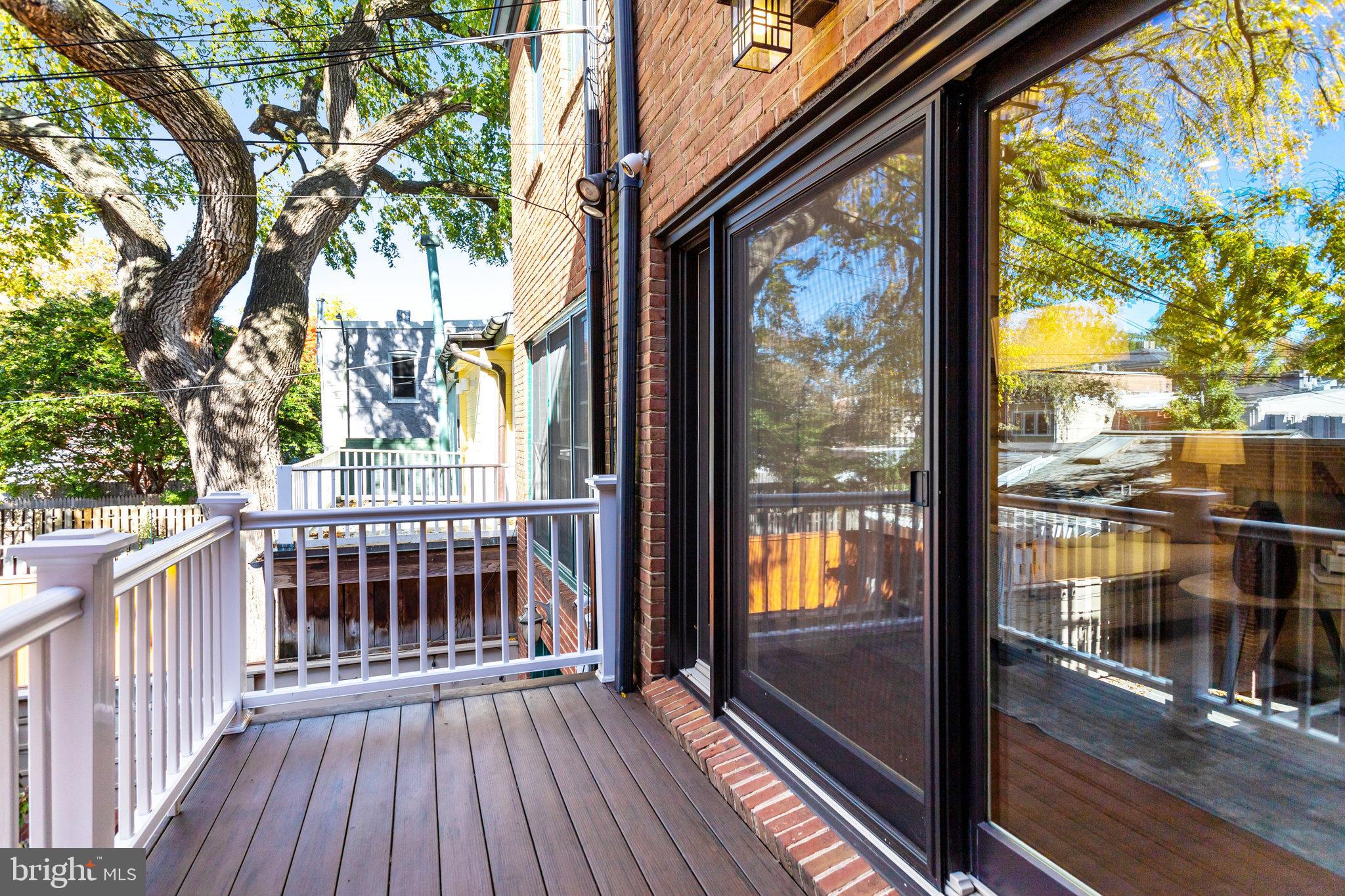 745 10th Street Southeast Washington, DC 20003 - Photo 16 of 54 a view of a porch with wooden floor and floor to ceiling window