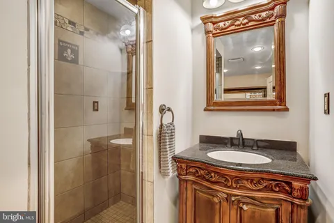 a bathroom with a bathtub and a mirror