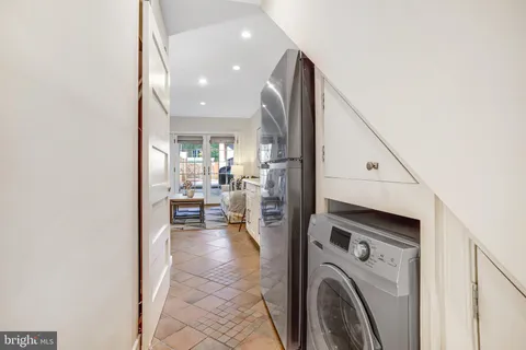 a bedroom with a bed and a mirror