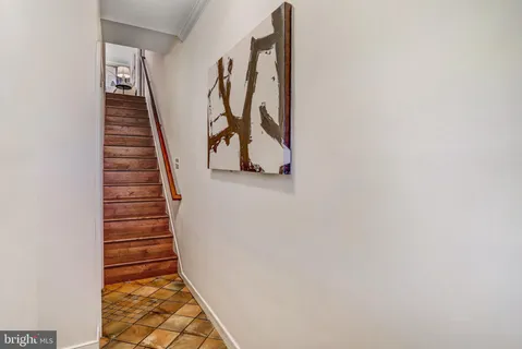 a front view of a house with a garden and plants