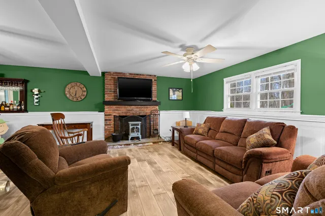 a view of a house with a yard covered in snow