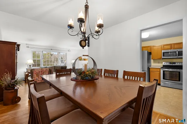 a living room with furniture and floor to ceiling windows
