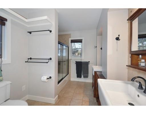 21 Sandy Pond Road Concord, MA 01742 - Photo 13 of 20 a bathroom with a sink and mirror
