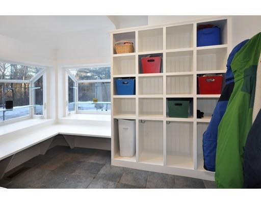 21 Sandy Pond Road Concord, MA 01742 - Photo 16 of 20 a living room with furniture and a book shelf