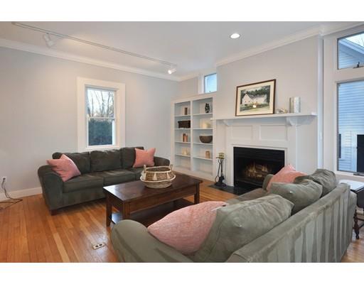 21 Sandy Pond Road Concord, MA 01742 - Photo 7 of 20 a living room with furniture and a fireplace