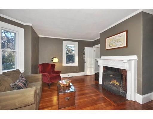 21 Sandy Pond Road Concord, MA 01742 - Photo 8 of 20 a living room with furniture a window and a fireplace
