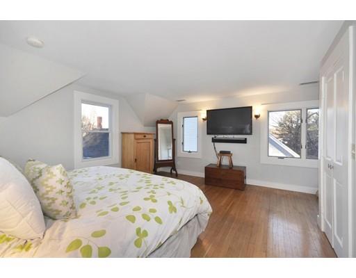 21 Sandy Pond Road Concord, MA 01742 - Photo 10 of 20 a bedroom with a bed and a flat screen tv