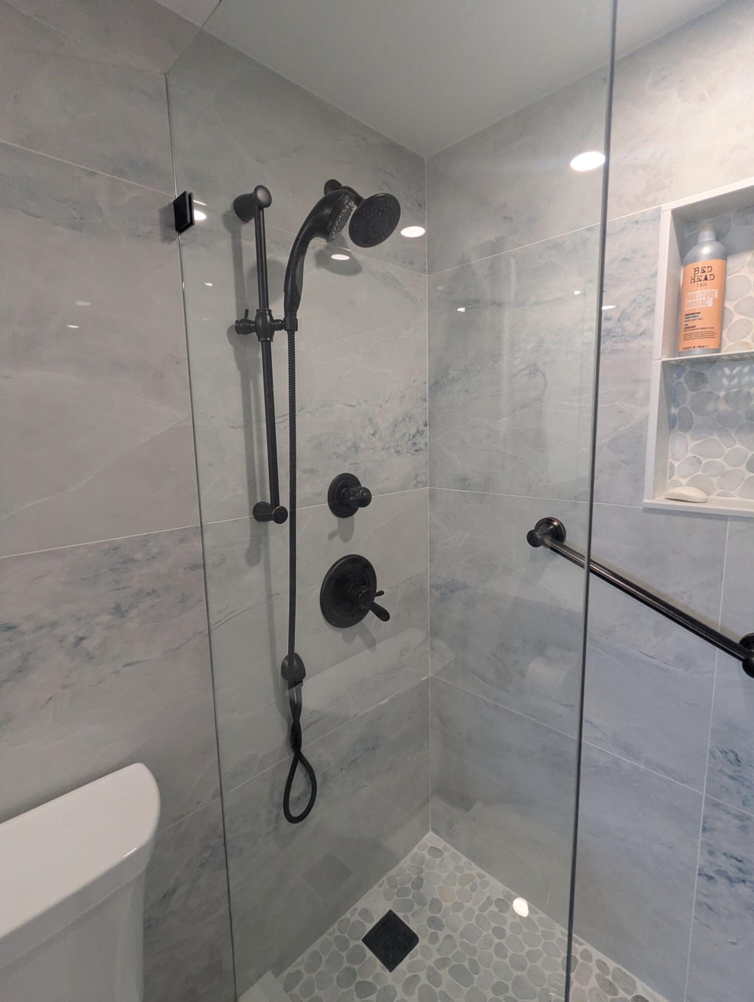 2121 North Ocean Boulevard, Unit 1006E Boca Raton, FL 33431 - Photo 24 of 64 a bathroom with a shower