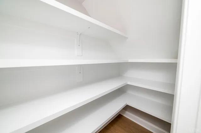 a bathroom with a sink a mirror and shower