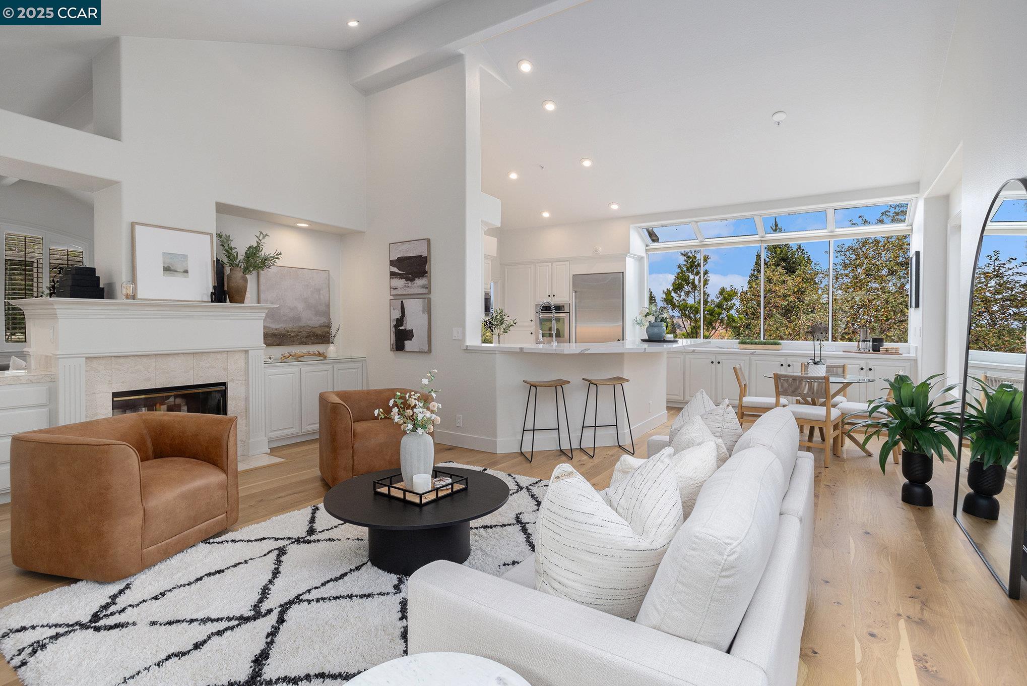 2199 Hidden Pond Road Lafayette, CA 94549 - Photo 13 of 40 a living room with furniture fireplace and a large window