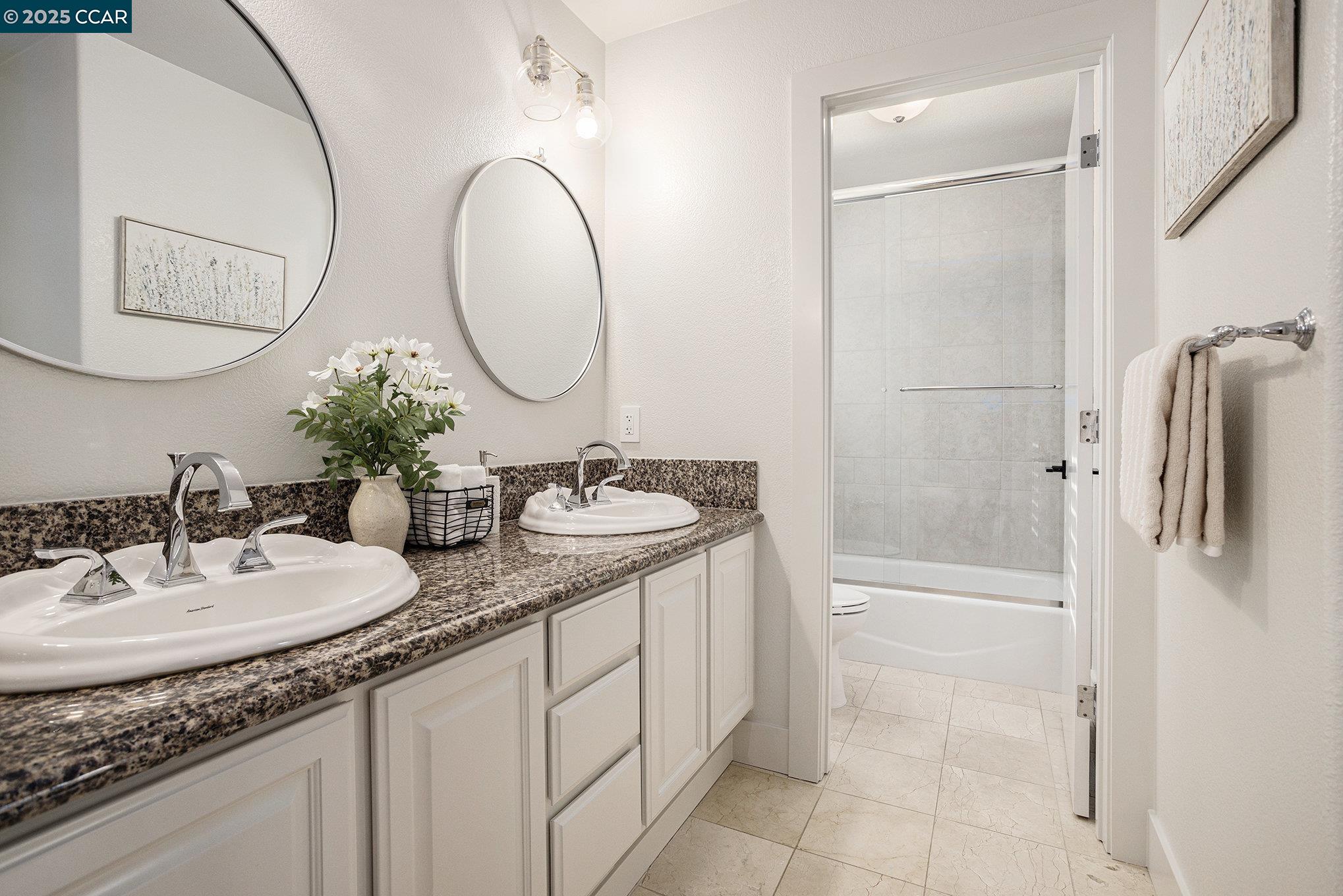 2199 Hidden Pond Road Lafayette, CA 94549 - Photo 17 of 40 a bathroom with a granite countertop sink mirror and a shower