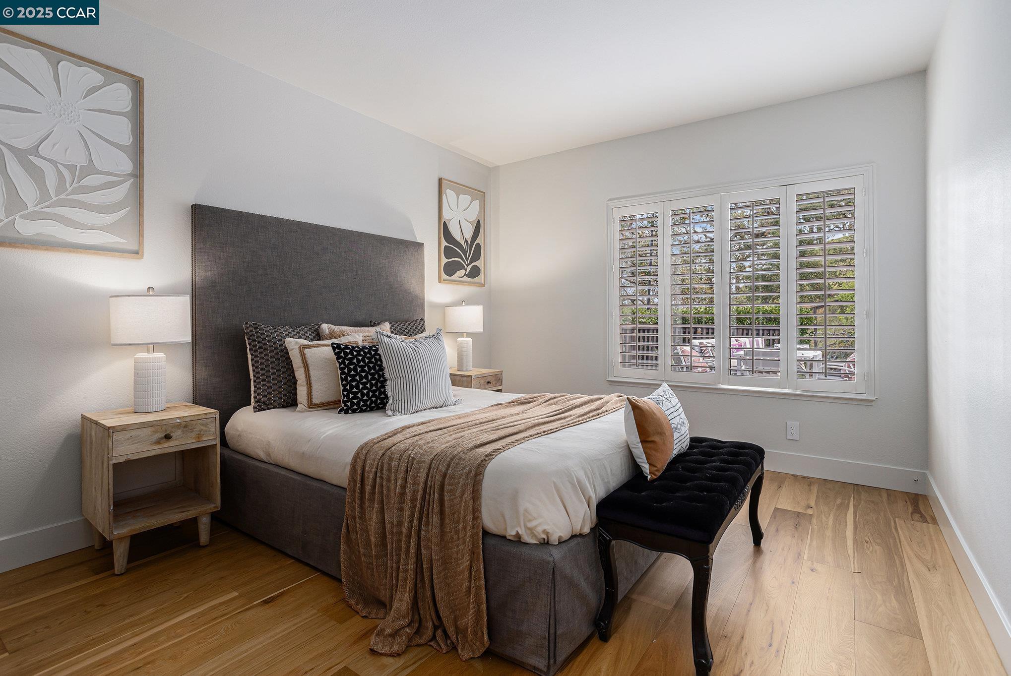 2199 Hidden Pond Road Lafayette, CA 94549 - Photo 19 of 40 a bedroom with a bed and wooden floor