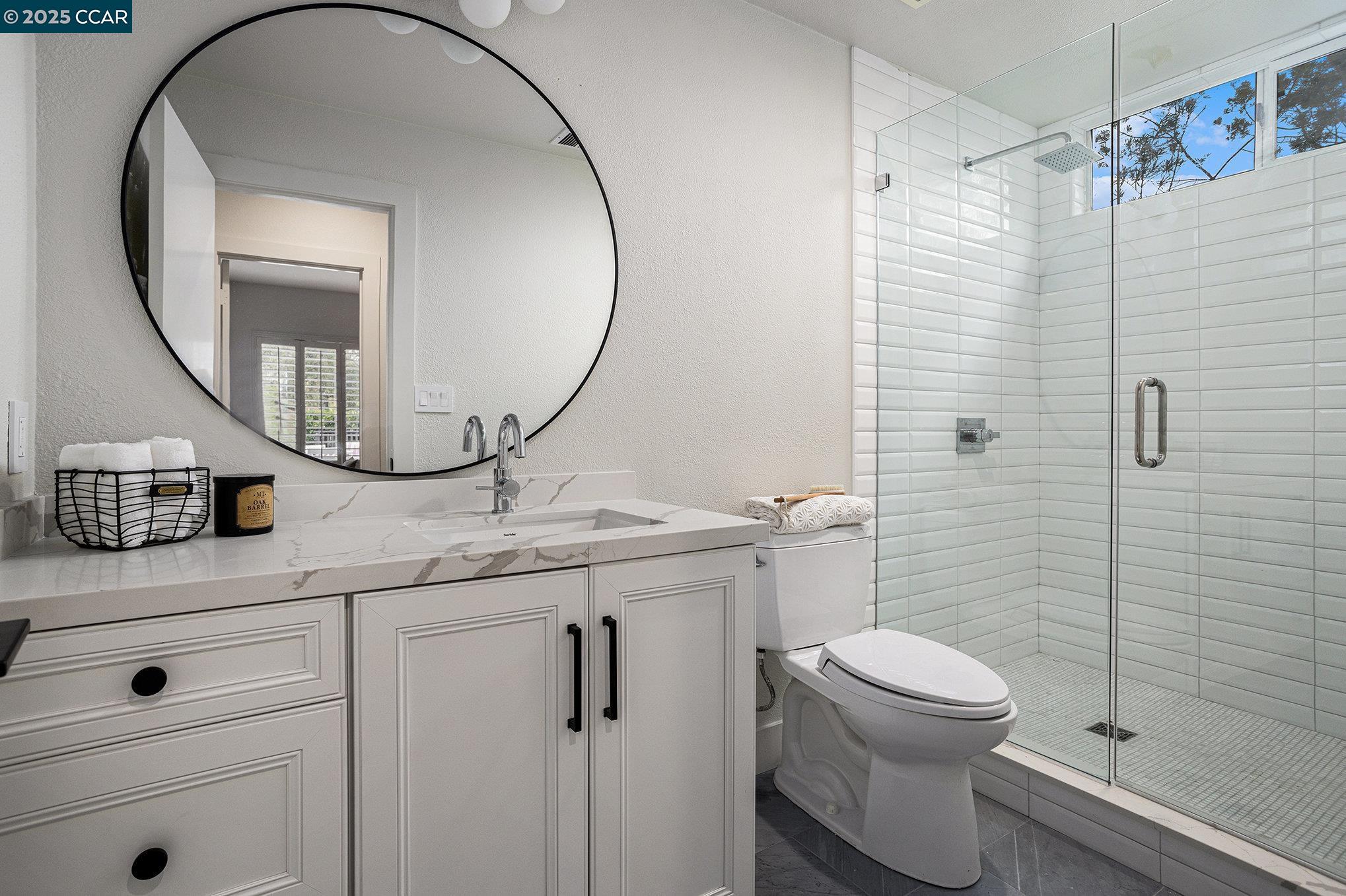 2199 Hidden Pond Road Lafayette, CA 94549 - Photo 20 of 40 a bathroom with a toilet a sink and mirror