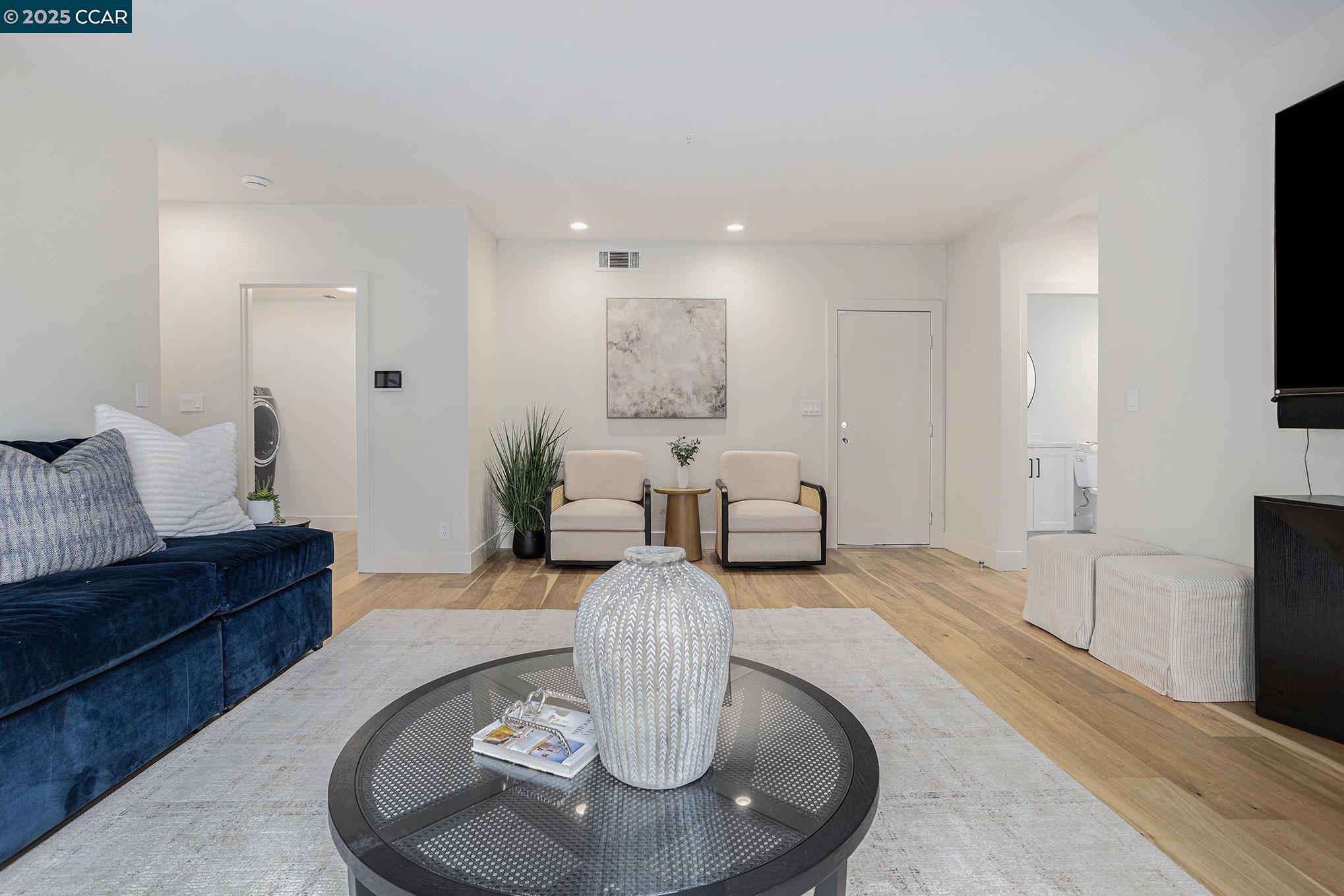 2199 Hidden Pond Road Lafayette, CA 94549 - Photo 23 of 40 a living room with furniture and a flat screen tv