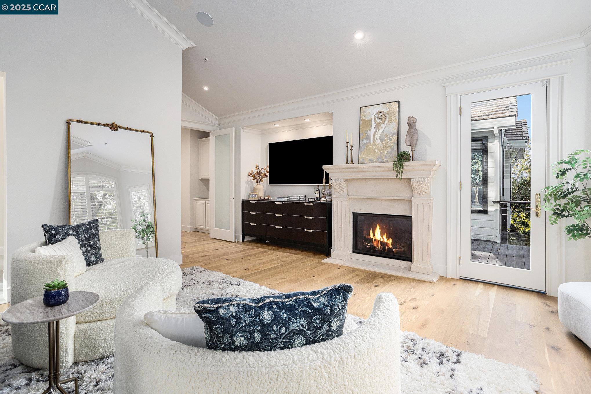 2199 Hidden Pond Road Lafayette, CA 94549 - Photo 26 of 40 a living room with furniture a fireplace and a flat screen tv