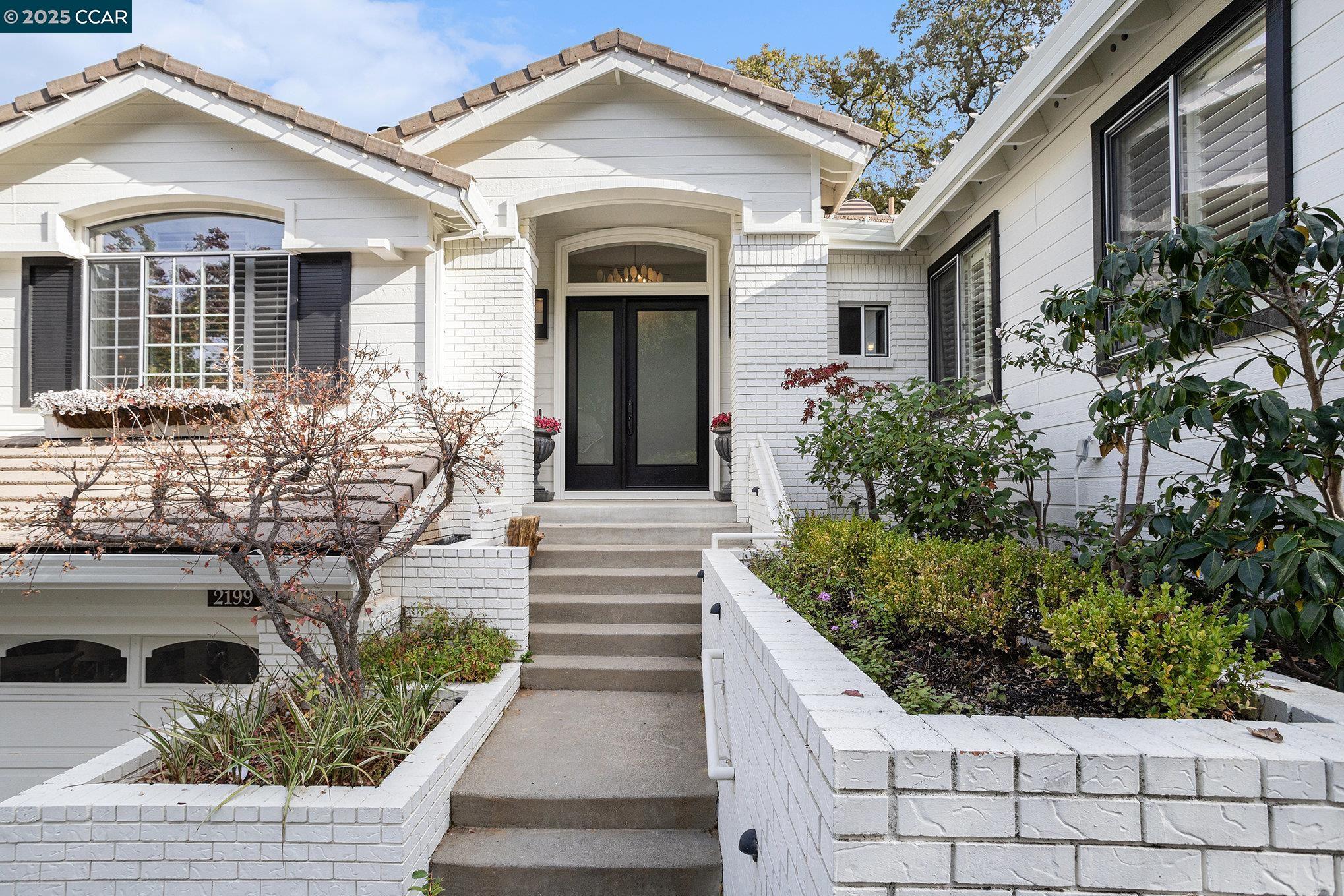2199 Hidden Pond Road Lafayette, CA 94549 - Photo 4 of 40 a front view of a house with garden