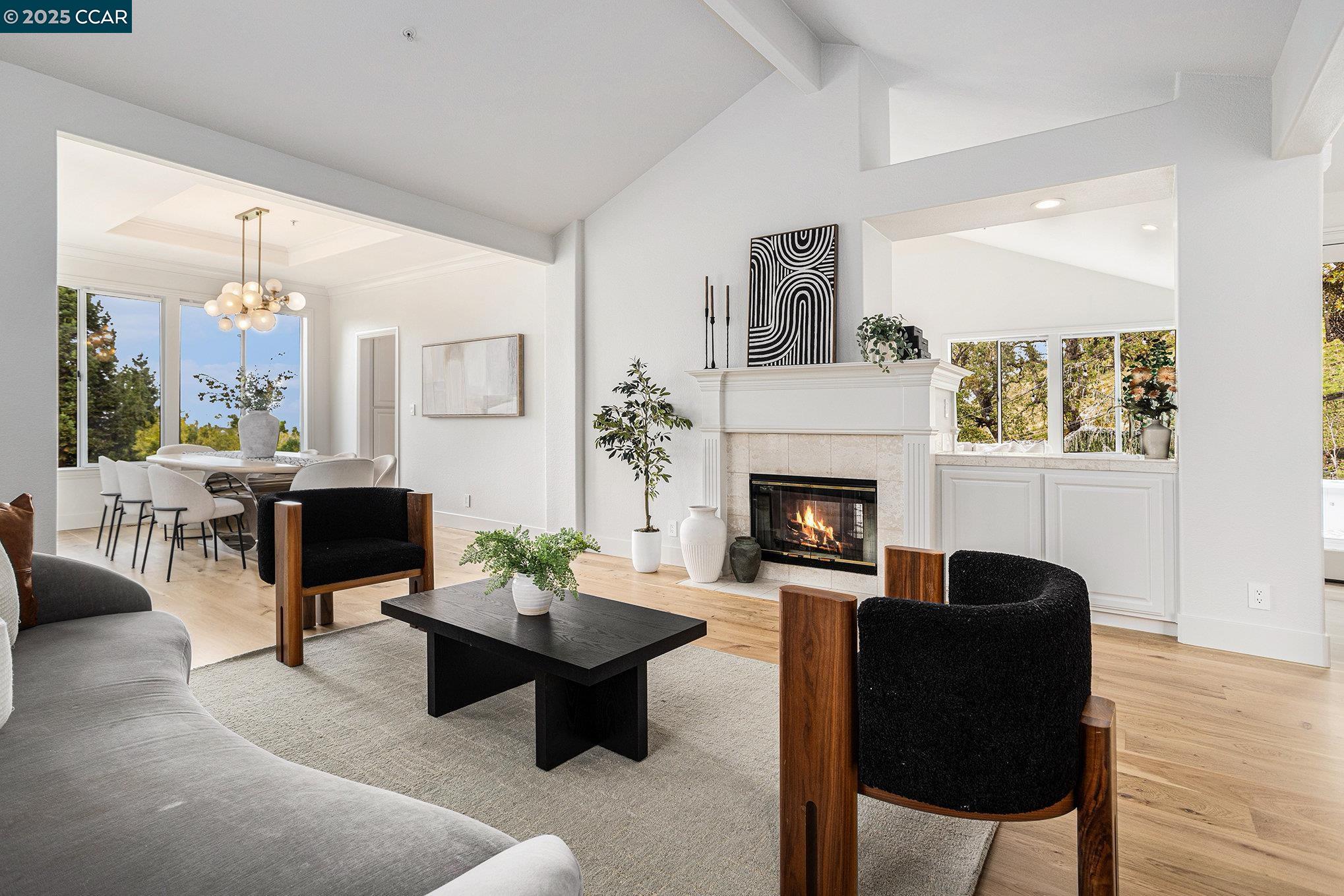 2199 Hidden Pond Road Lafayette, CA 94549 - Photo 6 of 40 a living room with furniture a lamp and a fireplace