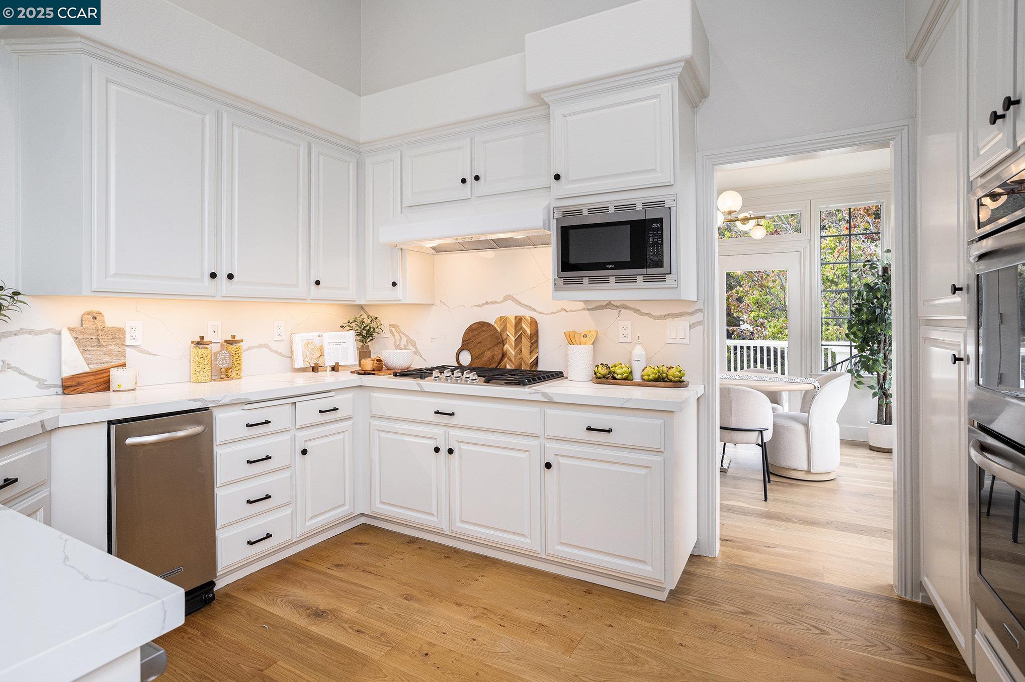 2199 Hidden Pond Road Lafayette, CA 94549 - Photo 9 of 40 a kitchen with cabinets appliances and a window