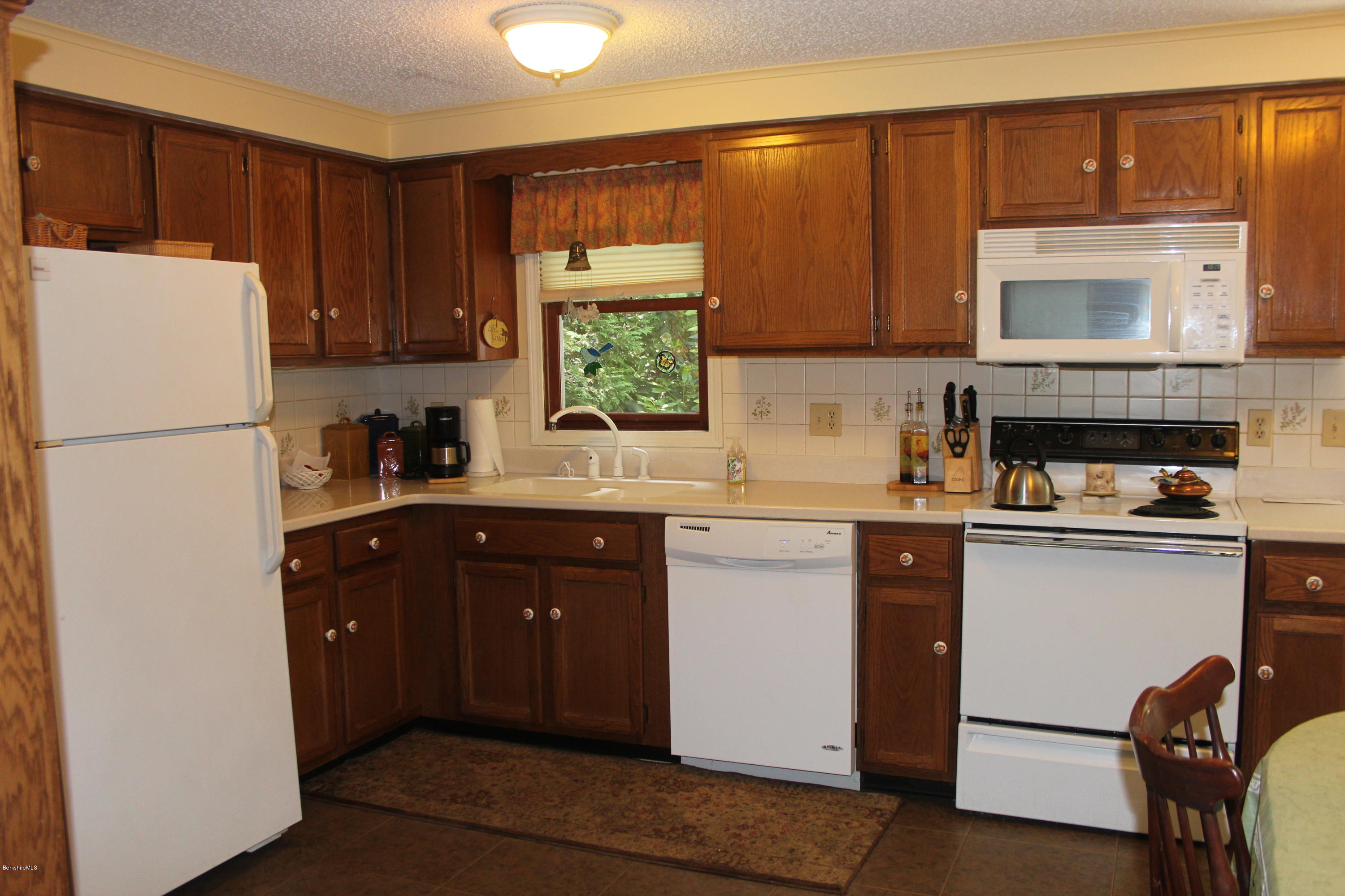 105 Cadwell Road, Unit 105 Pittsfield, MA 01201 - Photo 5 of 23 Updated Corian Kitchen