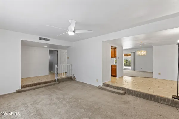 a kitchen with stainless steel appliances granite countertop a stove and a refrigerator