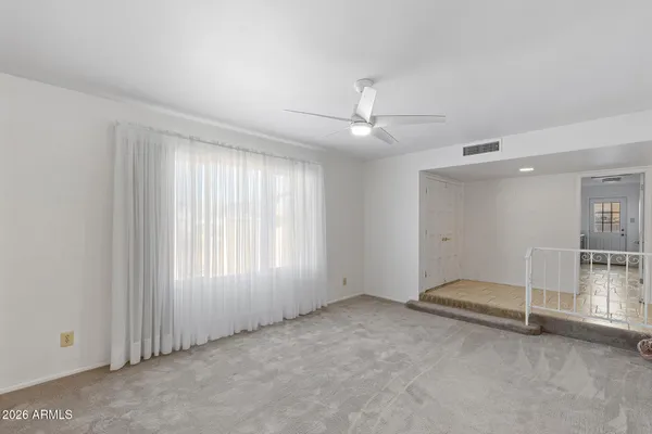 a view of an empty room with a window