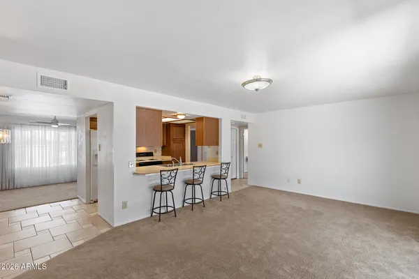 a kitchen with stainless steel appliances a sink dishwasher stove and cabinets