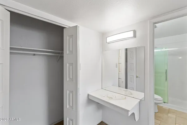 an empty room with a empty space and windows