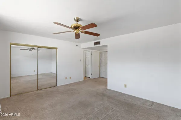 a view of an empty room with a window