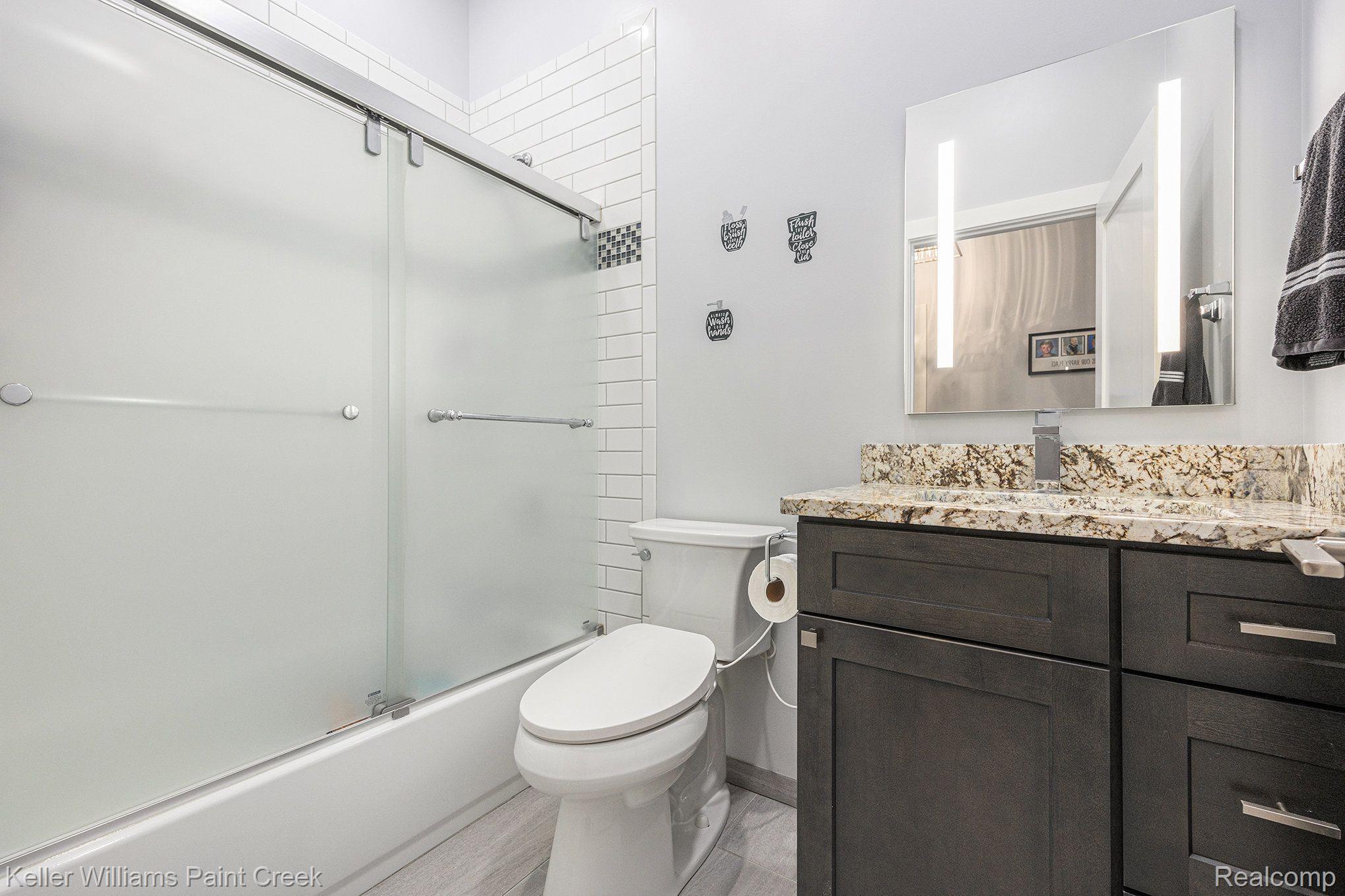1310 Trio Hill Road Leonard, MI 48367 - Photo 12 of 26 Second full bath with granite and ceramic detai