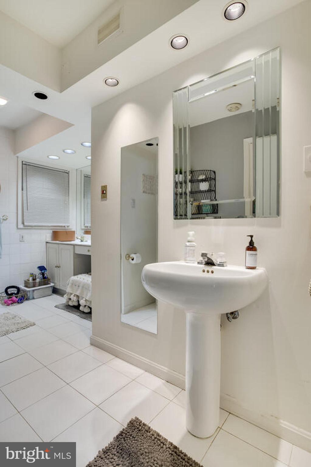 2546 Aster Road Port Republic, MD 20676 - Photo 40 of 54 a bathroom with a sink and a mirror