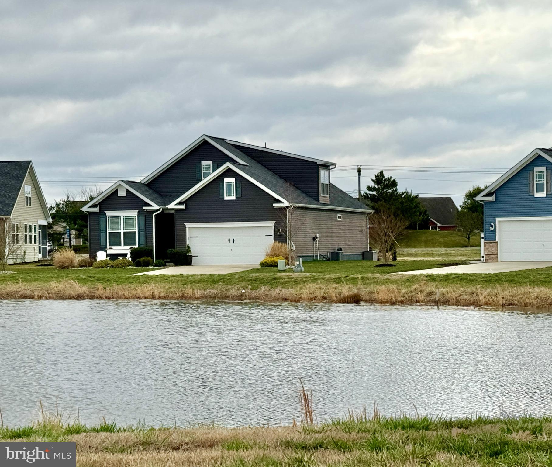 29528 Fieldstone Drive Milton, DE 19968 - Photo 1 of 34 a front view of a house with a yard