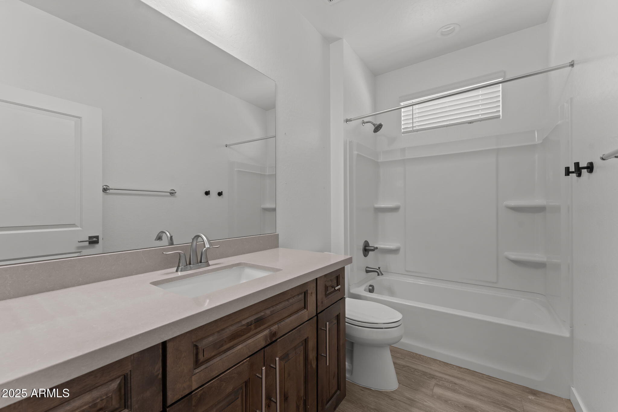 1985 West Ringo Road Wickenburg, AZ 85390 - Photo 17 of 25 a bathroom with a sink a toilet and a bathtub