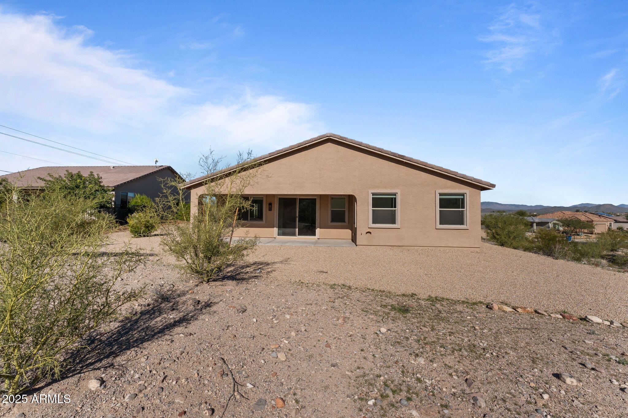 1985 West Ringo Road Wickenburg, AZ 85390 - Photo 20 of 25 a view of a house with a yard