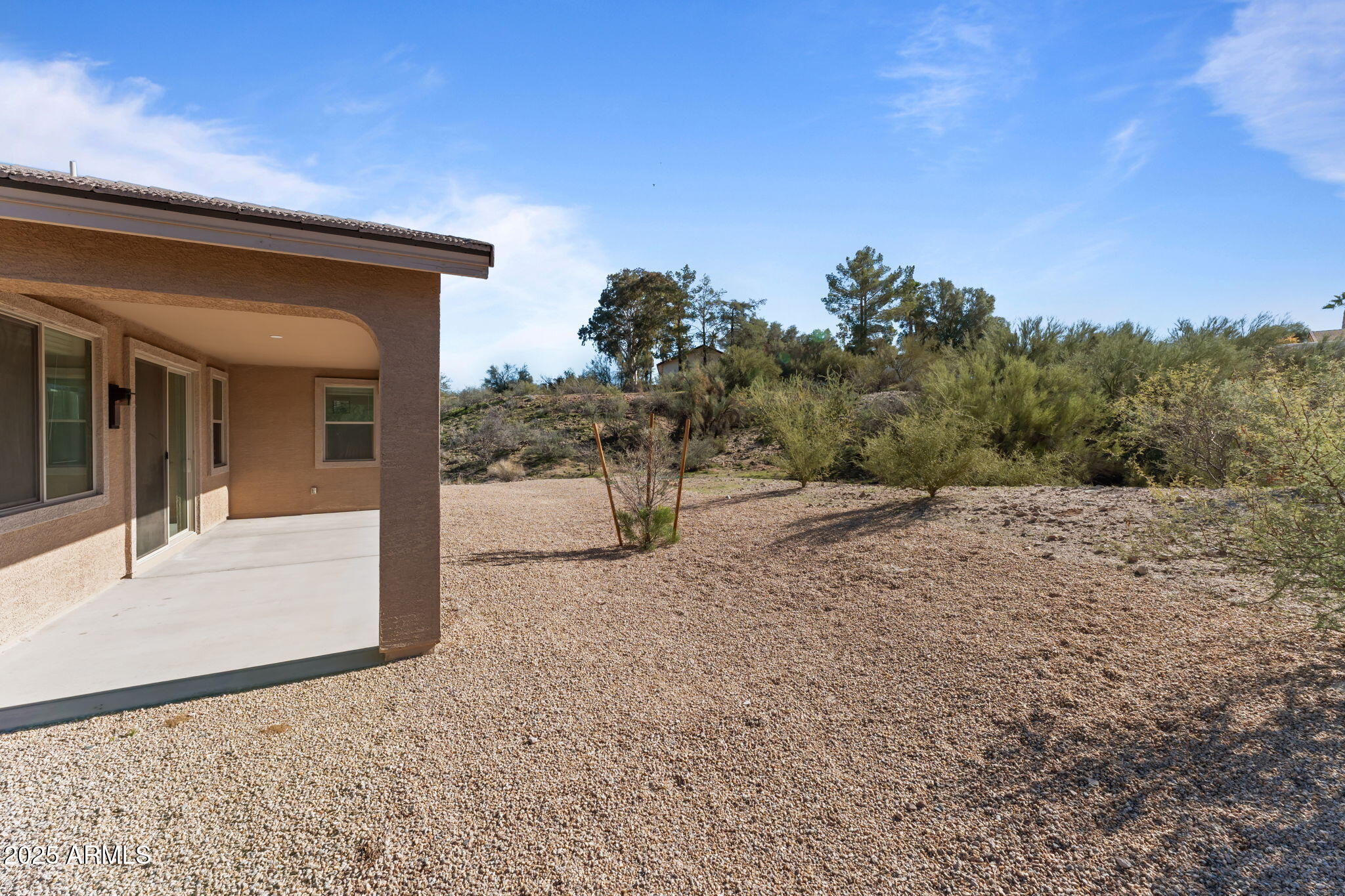 1985 West Ringo Road Wickenburg, AZ 85390 - Photo 21 of 25 a view of a house with a outdoor space