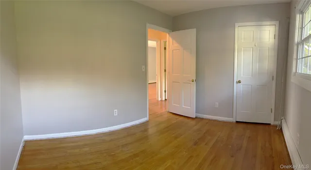 a bathroom with a sink a toilet and a large mirror