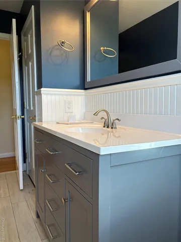 a bathroom with a glass door shower
